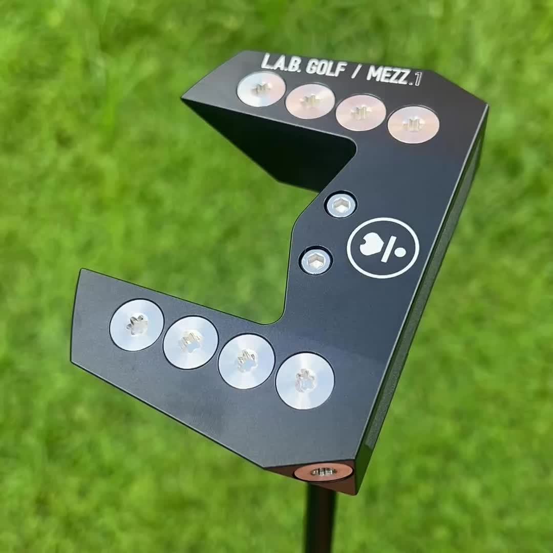 Golf putter head with L.A.B. Golf and MEZZ branding on a grass background